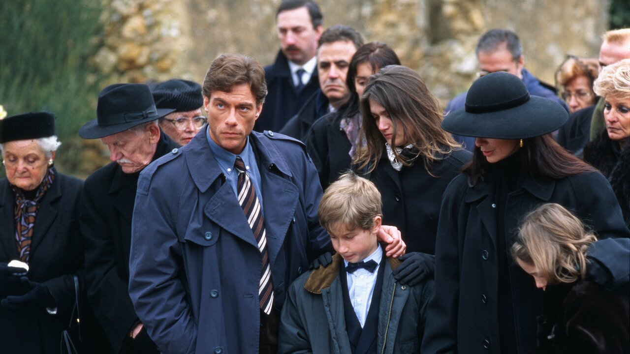 Jean Claude Van Damme attending a funeral